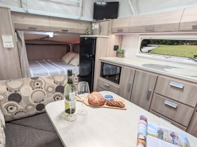 Broome-Jayco-Expanda-Club-Lounge-kichen-and-queen-bed.jpg